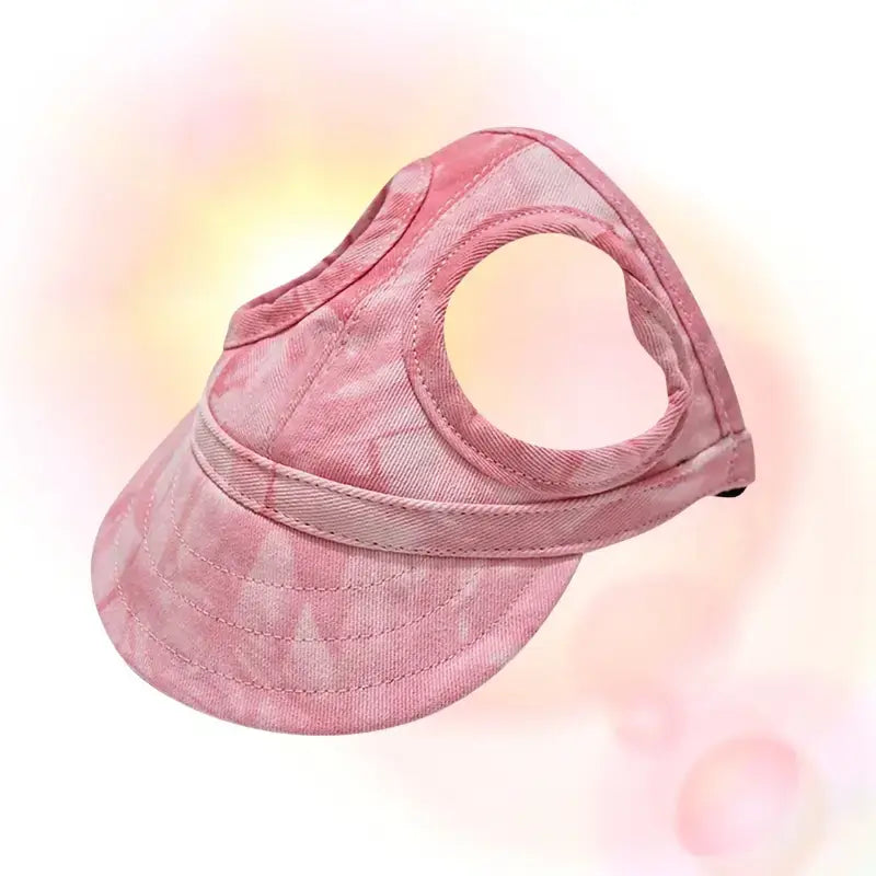 Une casquette pour animaux de couleur rose marbré.