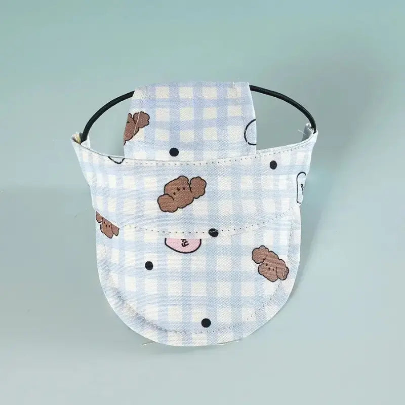 Casquettes pour chien de couleur bleu et blanc avec motif ourson.