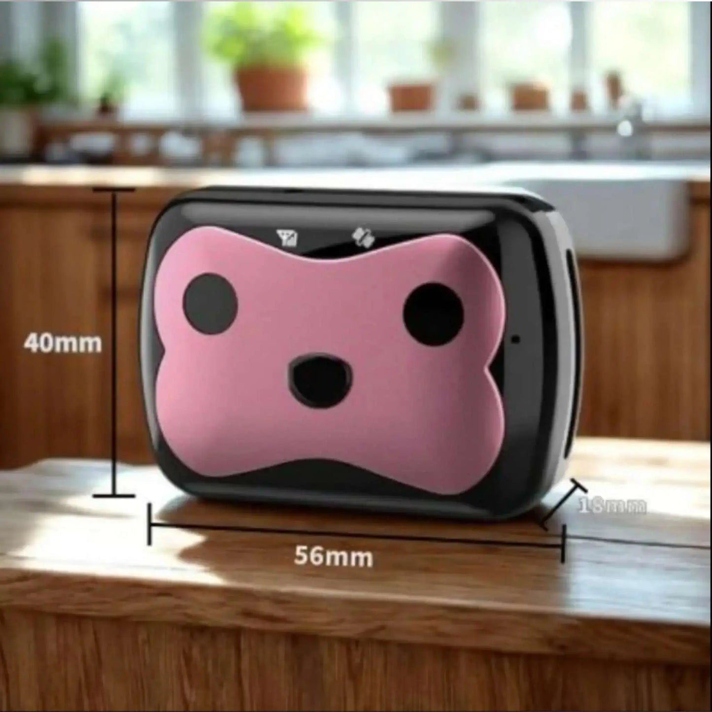 Un collier anti-fugue pour chien rose sur un comptoir de cuisine