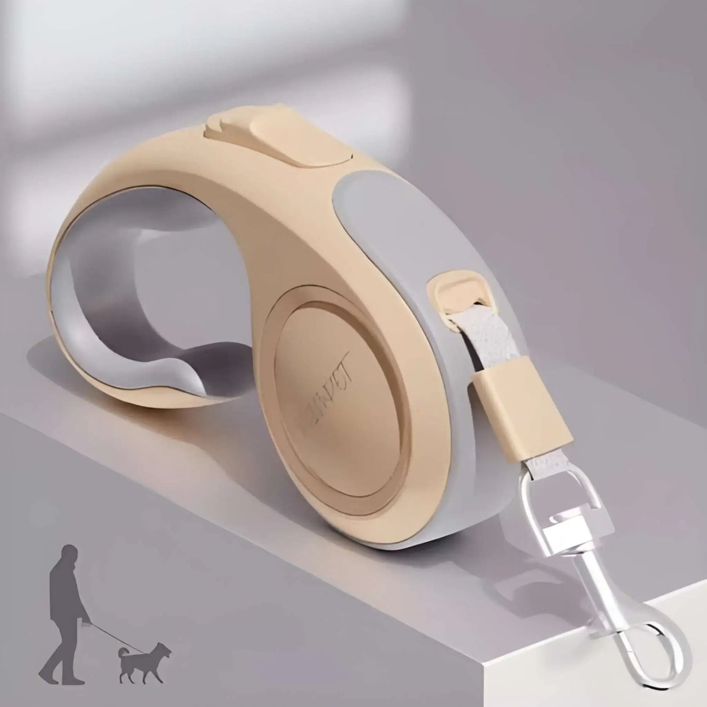 Une laisse enrouleur pour chien de couleur champagne.