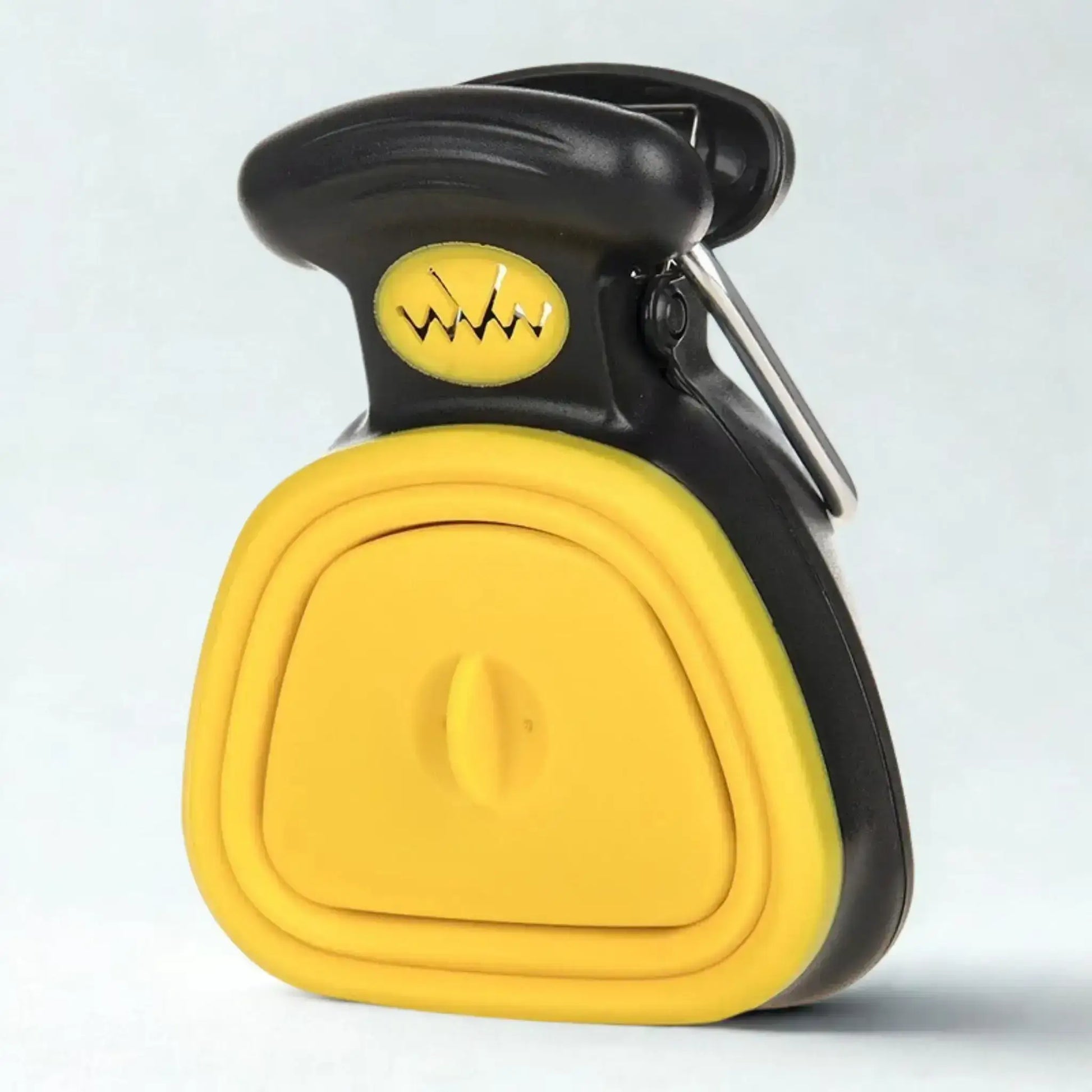 Un ramasse-crotte pour chien de couleur jaune.