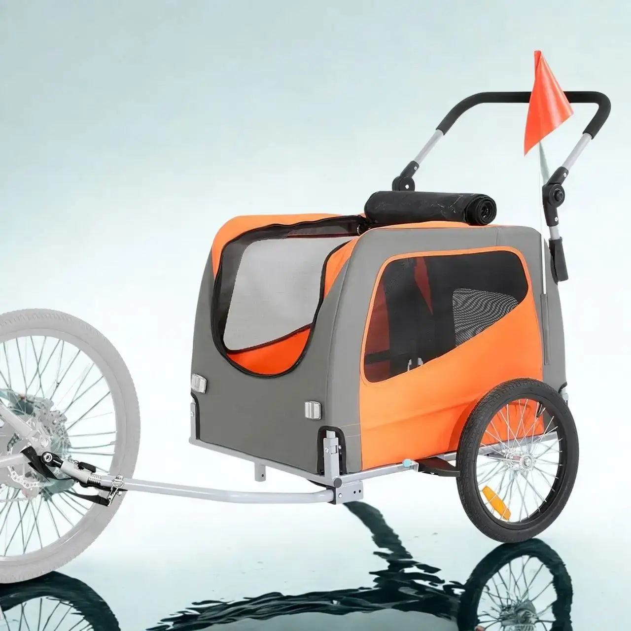 Une remorque de chien pour vélo de couleur orange.
