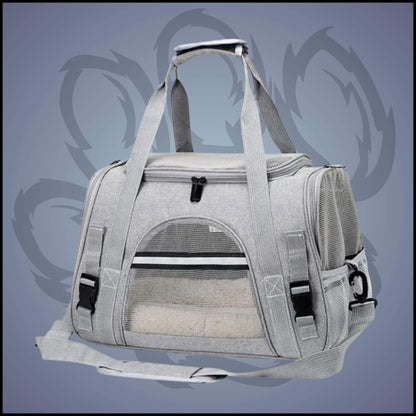 Un sac de transport pour chien de couleur gris peut être porté à la main ou en bandoulière. 